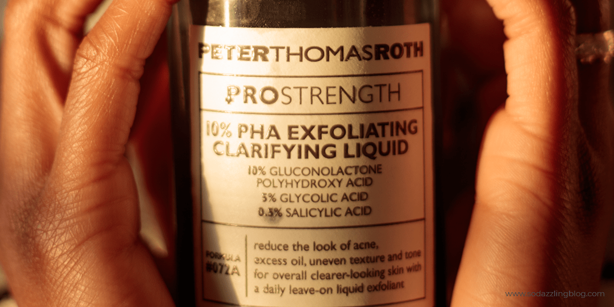 Image of woman holding the Peter Thomas Roth pro strength 10% exfoliating clarifying liquid for the blog post that talks about PHAS in Skincare and breastfeeding safe skincare