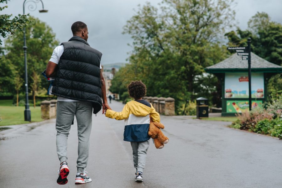 Father and son on a nature walk at a local park